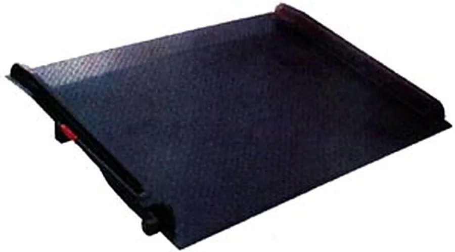 Steel dock board with a raised side curb and a release lever at the leading edge