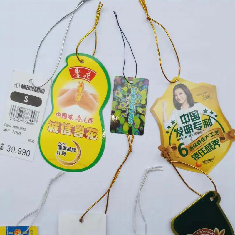 Finished paper tag with threaded rope and secured knot from the automatic threading machine