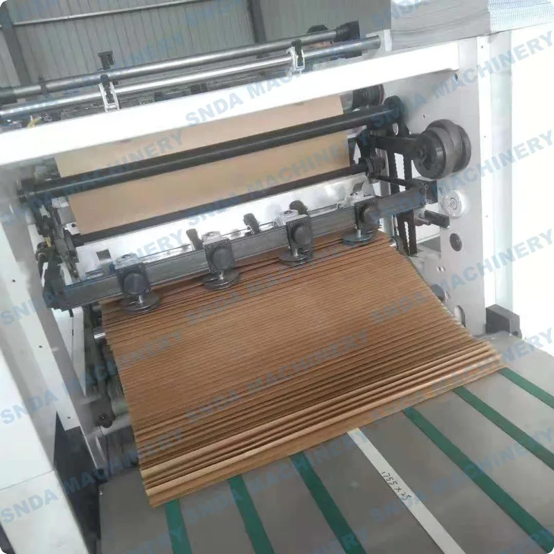 Close-up of the conveyor system stacking fanfold sheets after folding