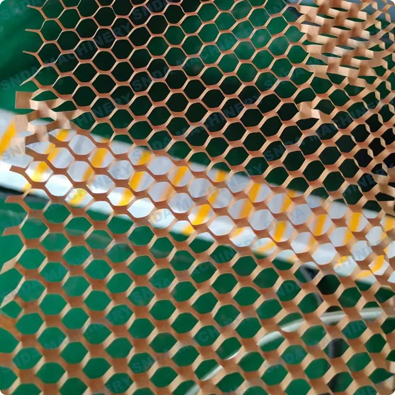 Finished honeycomb paper sheets being cut and collected on the conveyor belt