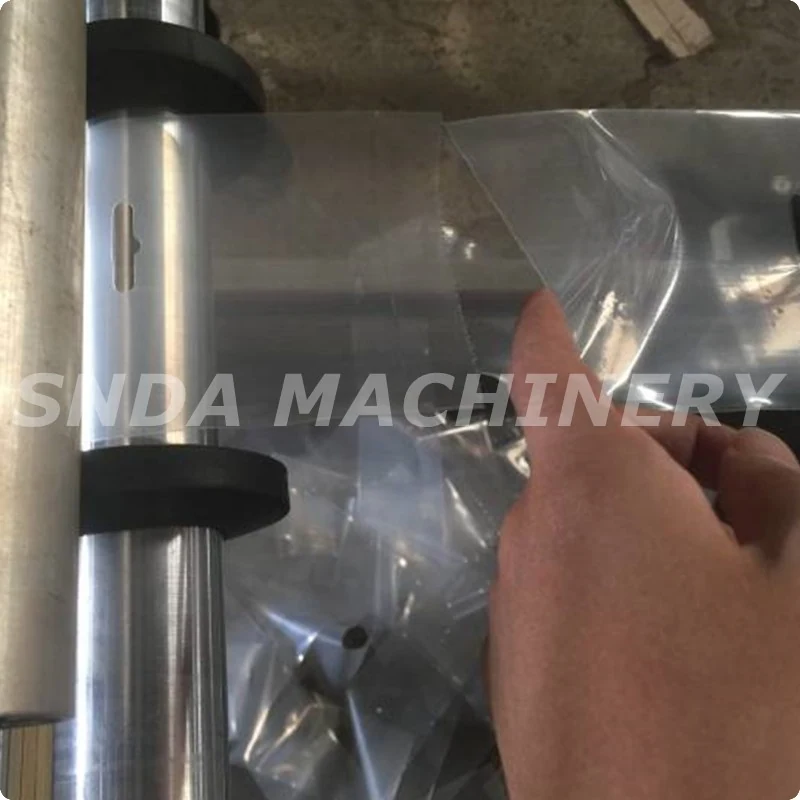 Machine in operation with film being fed and bags being formed