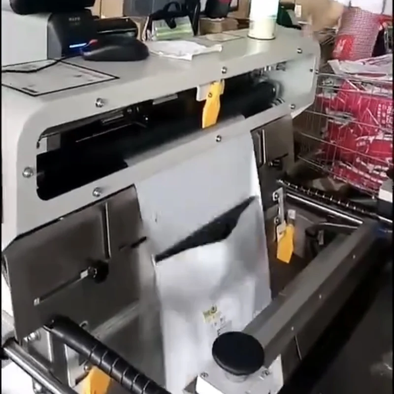 Machine installed in a small production area with pre-opened bag roll and finished bags ready for discharge