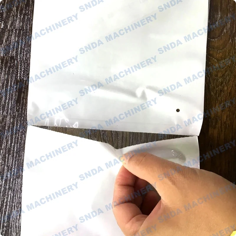 Close-up of the zig-zag folding mechanism forming a pre-opened bag