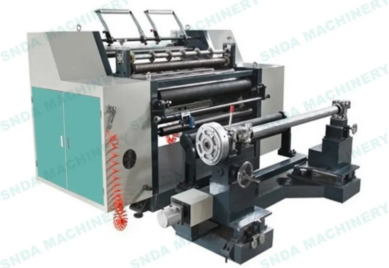 Industrial slitting and rewinding machine with rollers, unwind shaft and teal control cabinet on white background