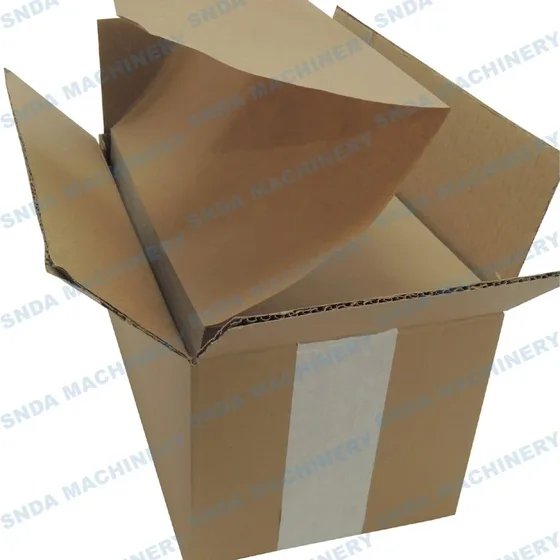 Open brown corrugated cardboard box with a paper liner inside, photographed on a white background