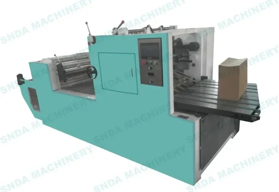 Teal industrial bag making machine with control panel, rollers and conveyor table