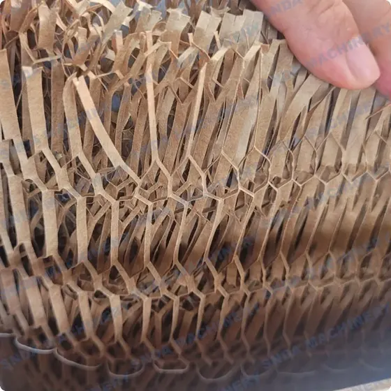 Hand stretching expanded kraft paper honeycomb cushioning wrap