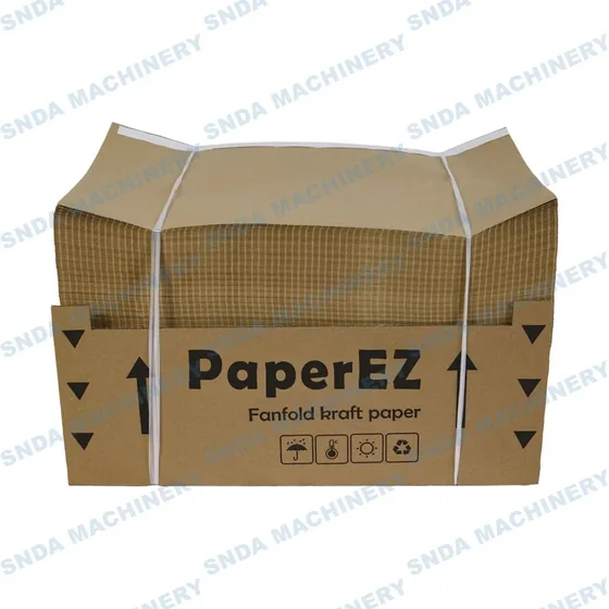 Cardboard box containing fanfold kraft paper with handling symbols
