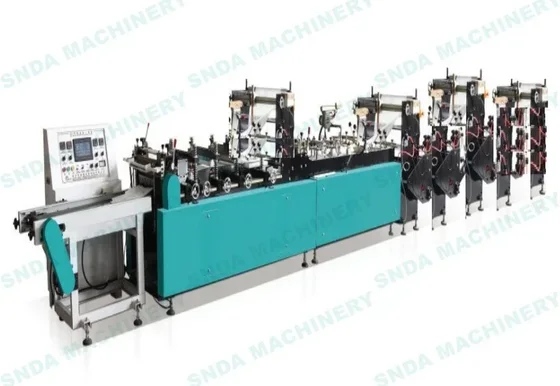 Industrial bag-making machine with teal cabinet, control console, and multiple roller stations on white background