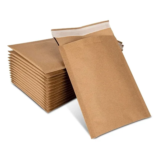 Stack of kraft padded bubble mailer envelopes with one standing upright showing peel-and-seal strip on white background