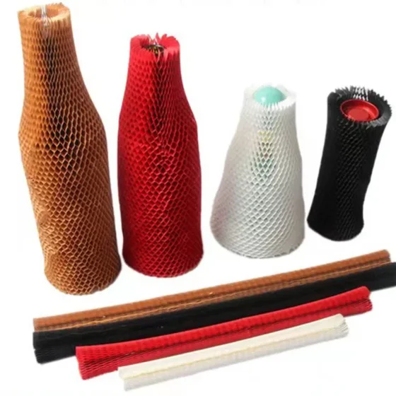 Honeycomb kraft paper protective sleeves in brown, red, white and black covering bottles, with flat paper tubes below