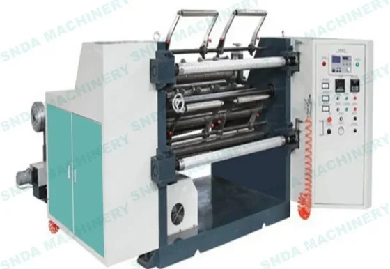 Industrial slitting and rewinding machine with metal rollers, control panel, and teal cabinet on white background