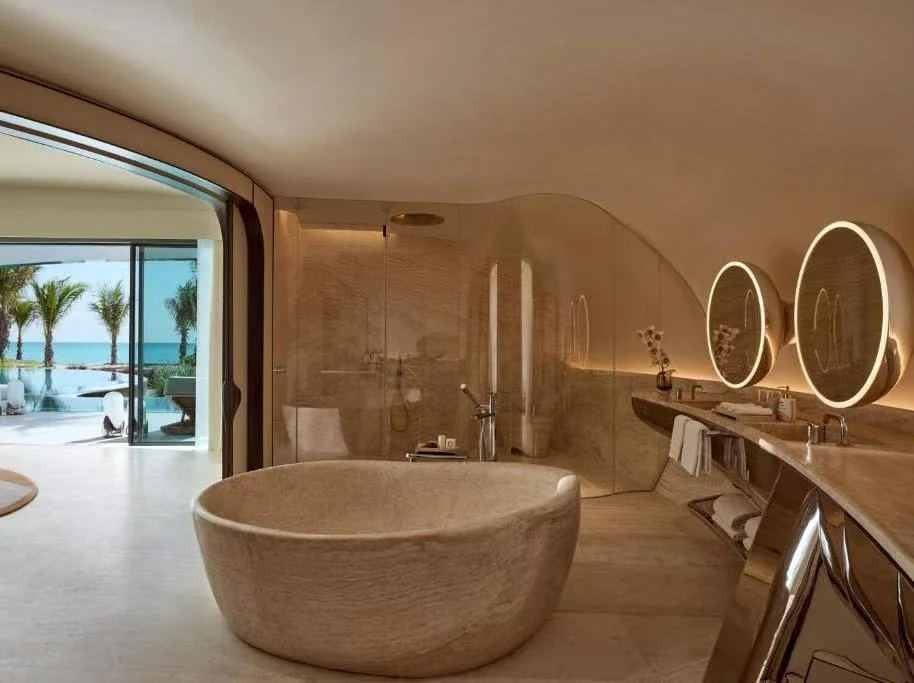 Resort bathroom with freestanding bathtub and vanity supplied by Songdom