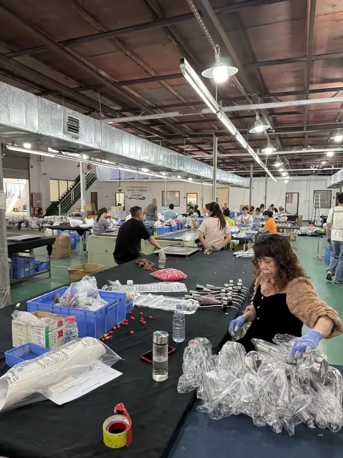 Lighting factory workshop assembling and packing a hospitality FF and E order