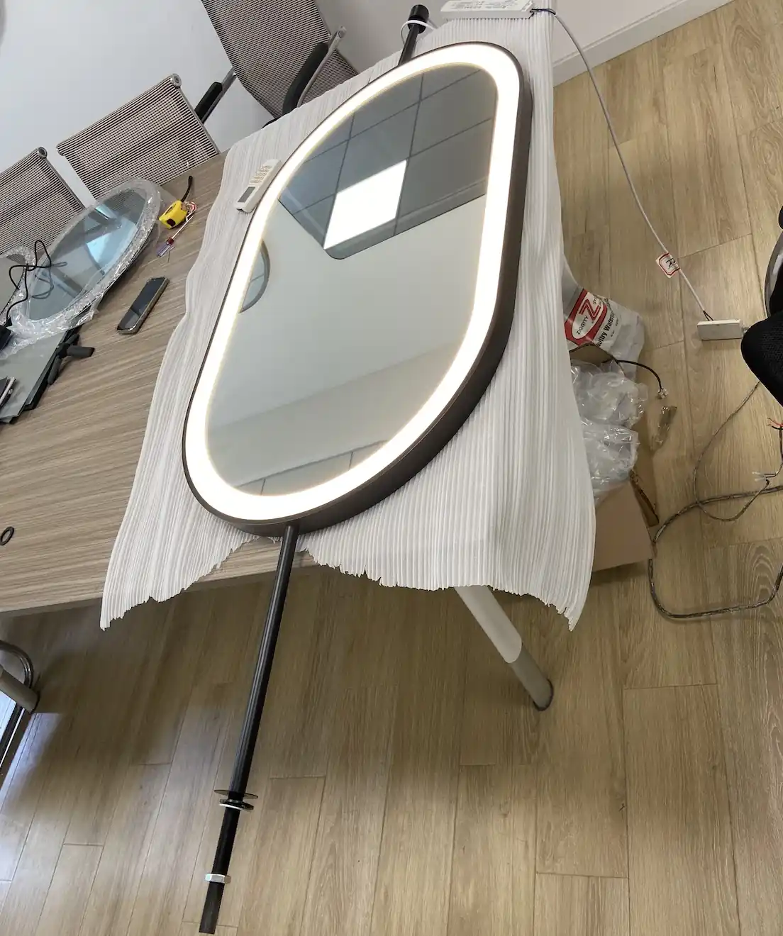 Vanity lighted mirror during installation and function testing
