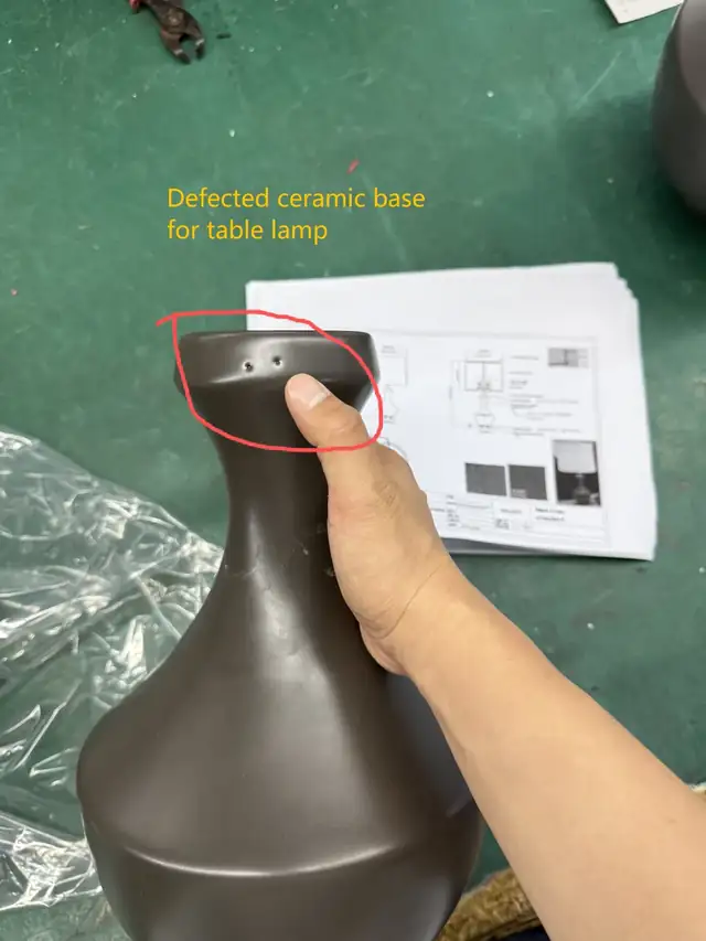 Defective ceramic lamp base identified and rejected during inspection