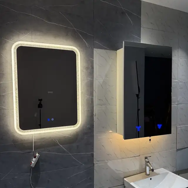 Lighted mirror and mirror cabinet installed on a marble bathroom wall