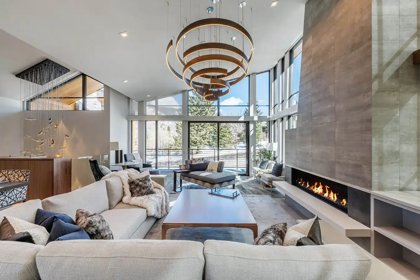 Living room with a layered chandelier above the seating