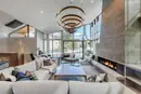 Living room with a layered chandelier above the seating