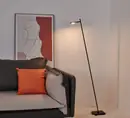 SL2312-1C floor light lit in a living room corner