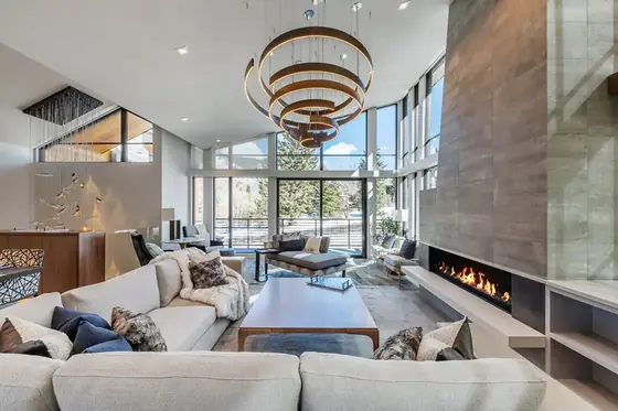 Living room with a layered chandelier above the seating