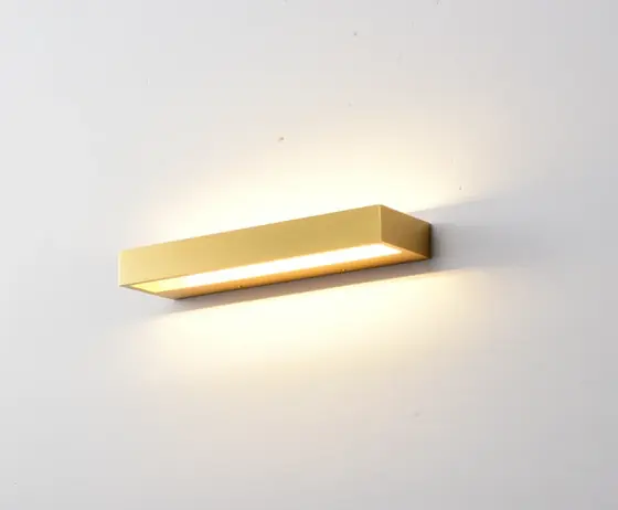 SB2167 IP54 aluminium wall light in gold mounted on a wall