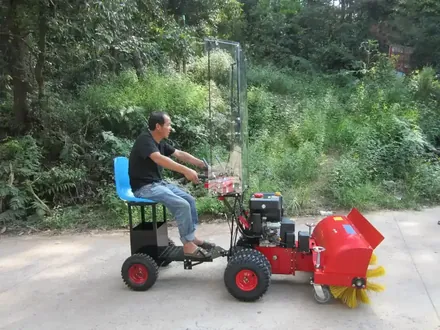 41.7 inch snow sweeper side view showing brush head and wheels