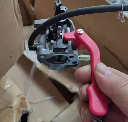 Loncin engine carburetor for snow blower on white background