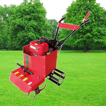 Mini cultivator shown from the side with handlebars and narrow rotor