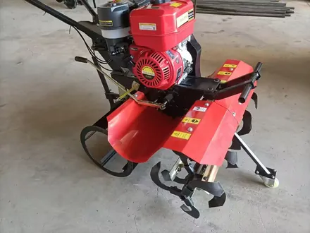 Rotary tiller shown from the rear with the shift controls visible
