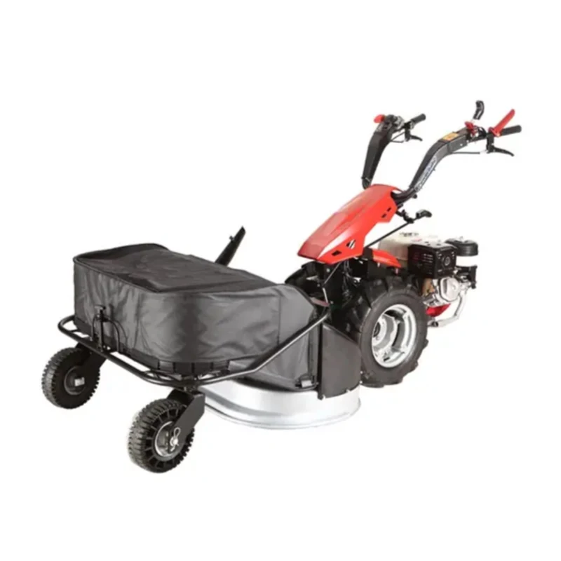 Two wheel tractor fitted with a rotary lawn mower attachment and collector