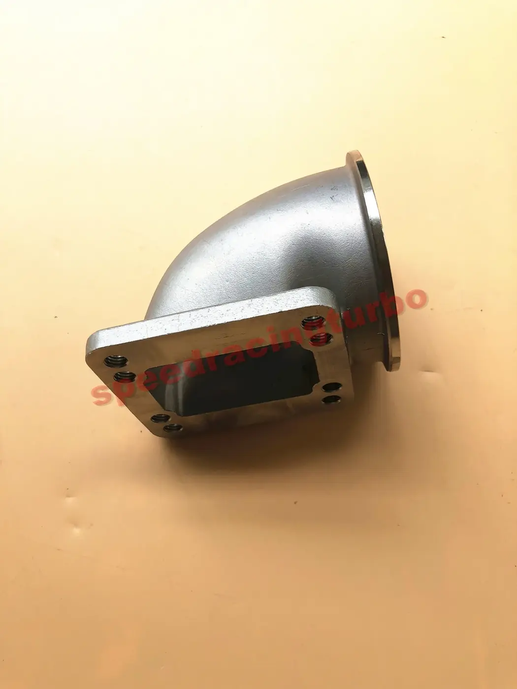 Side view of the 90 degree cast elbow showing tight radius and silver finish