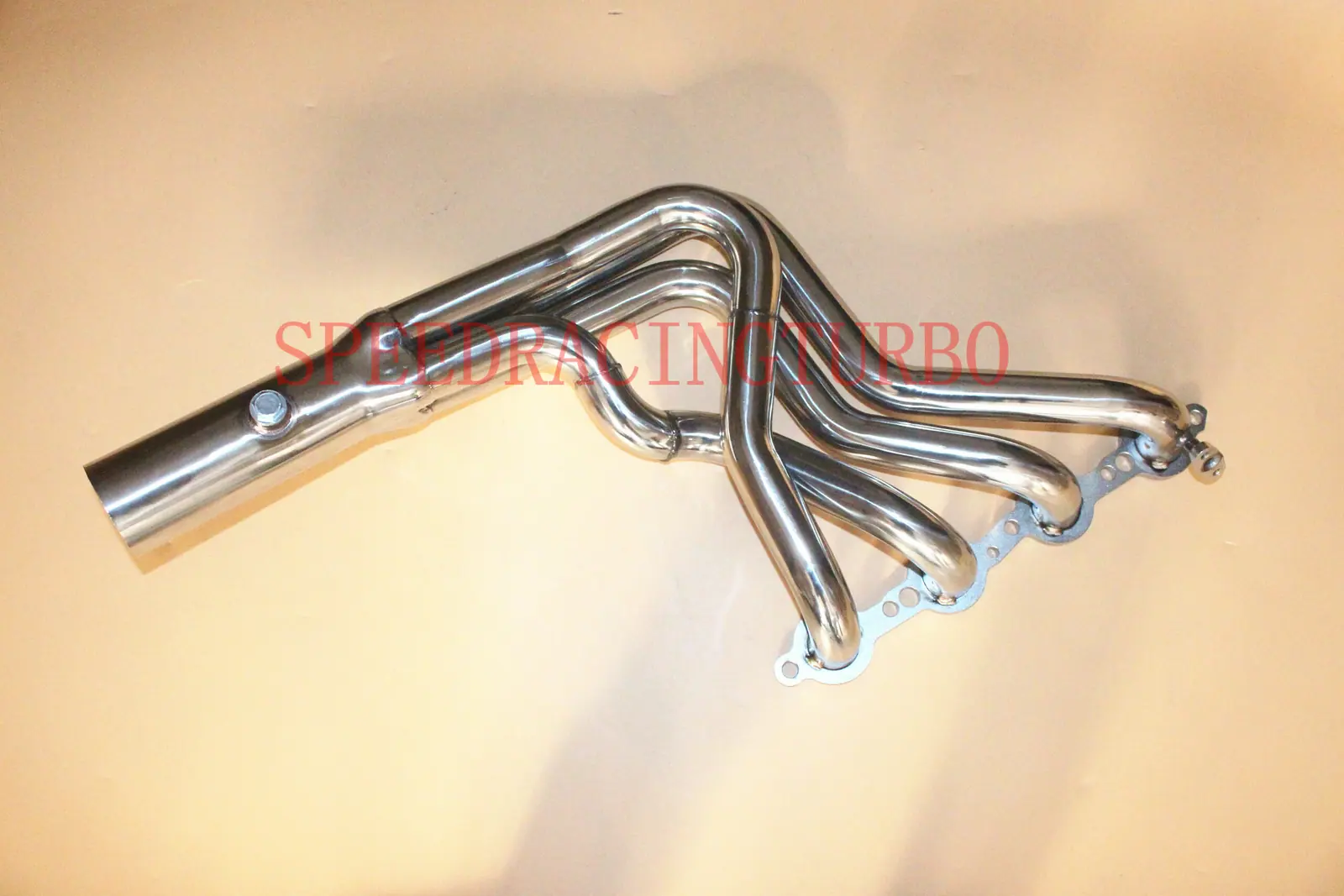 Back view of the header showing exhaust outlet and mirror polish finish