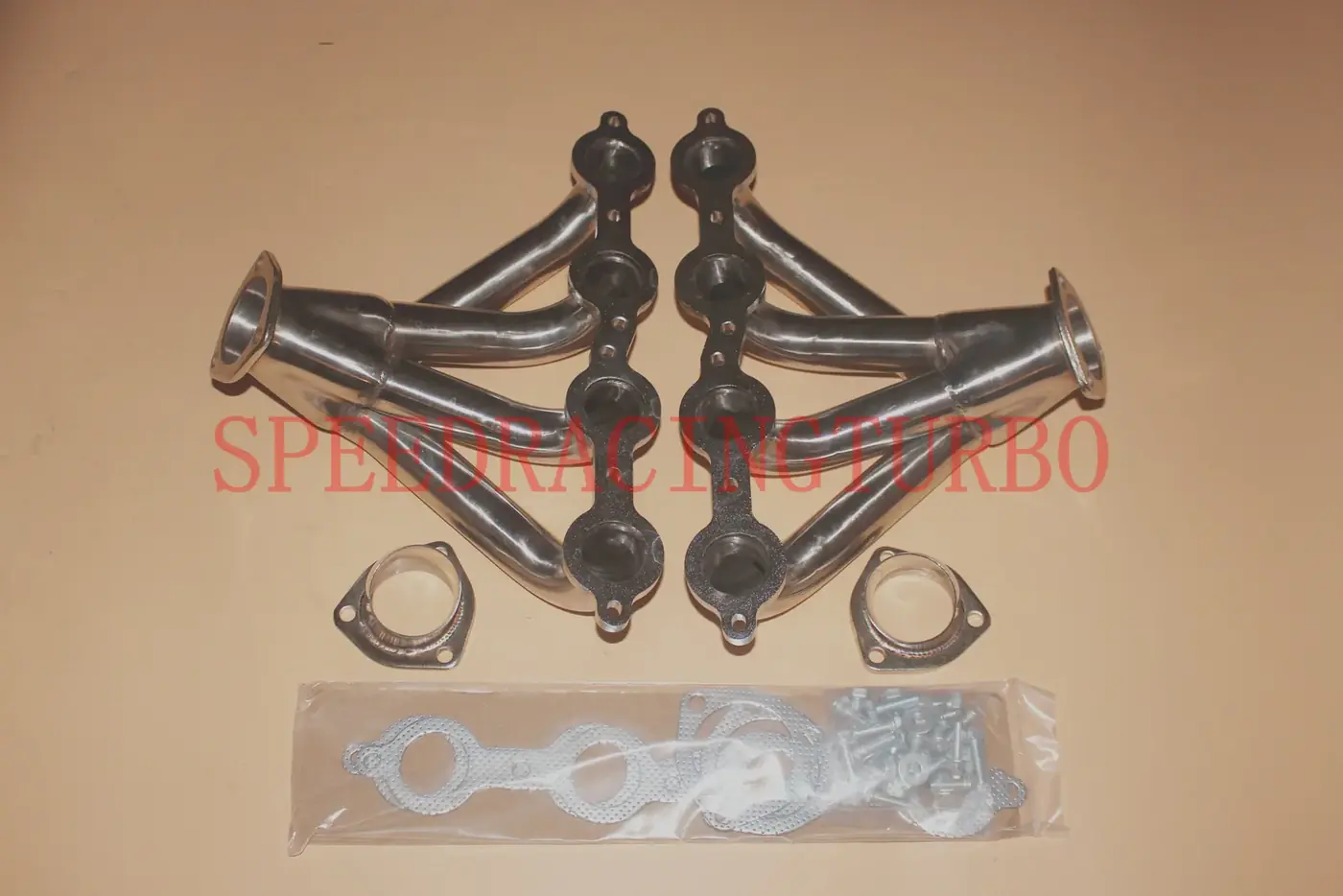 Side view of tight-fit block hugger exhaust headers with polished finish and 1-5/8 inch primaries