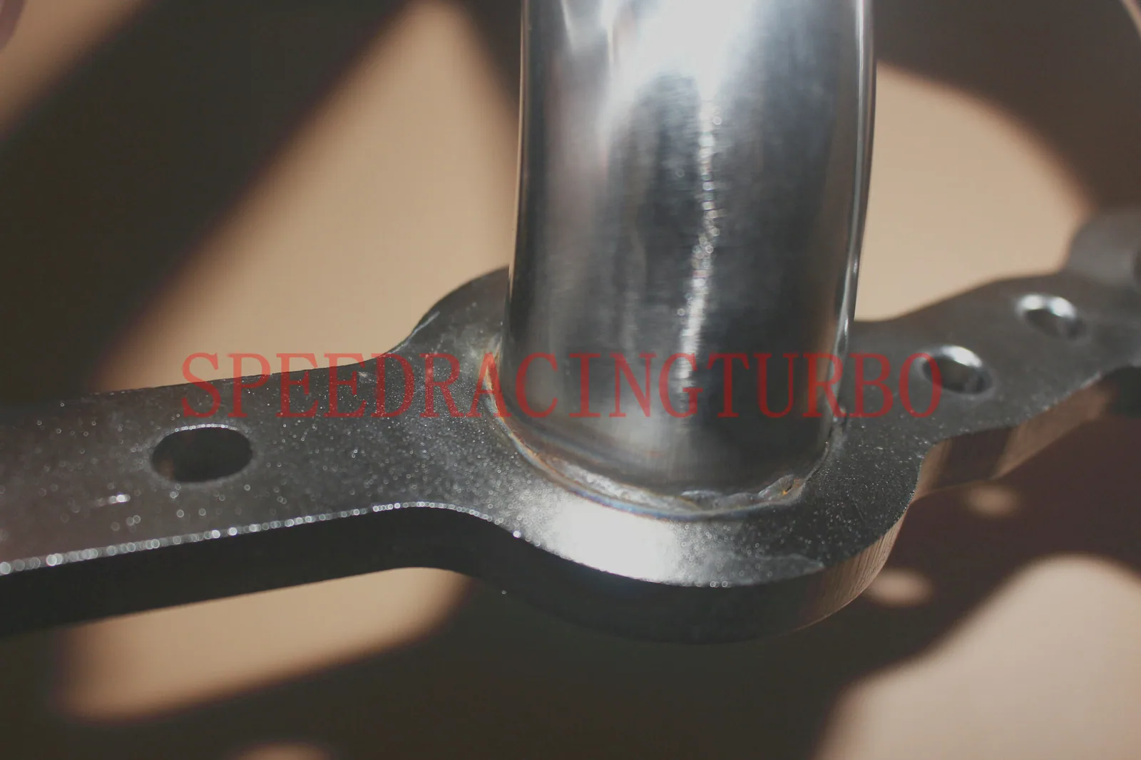 Top view of exhaust headers showing 1-5/8 inch primary tubes and flange alignment