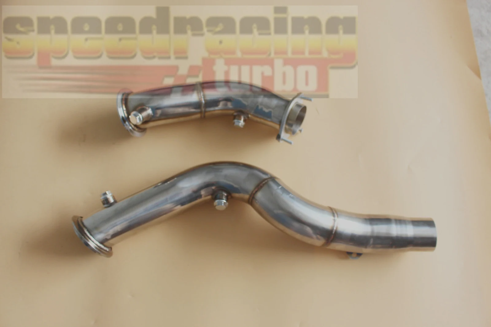 Close-up of CNC machined flange on 3 inch T-304 stainless steel downpipe for BMW S55