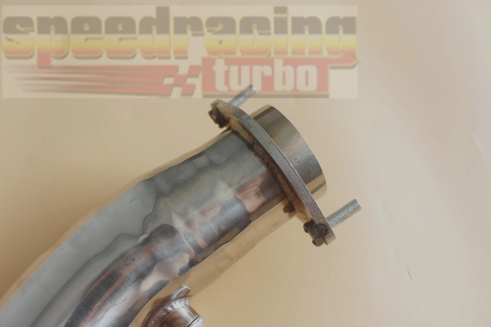Bottom view of 3 inch downpipe showing black hardware and flange bolt pattern