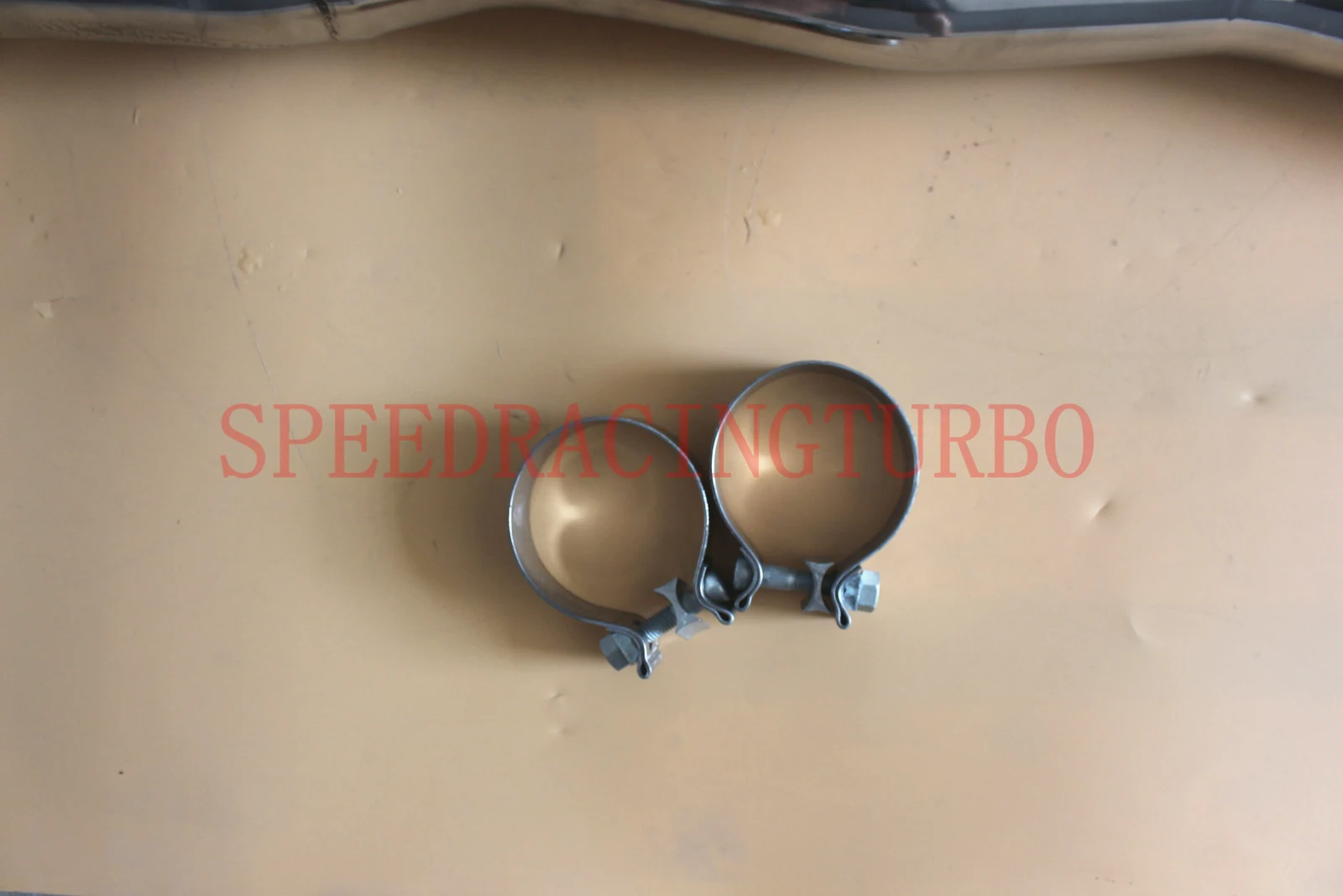 Exhaust header and downpipe kit laid out with gaskets and bolts for 2014-2016 Corvette C7