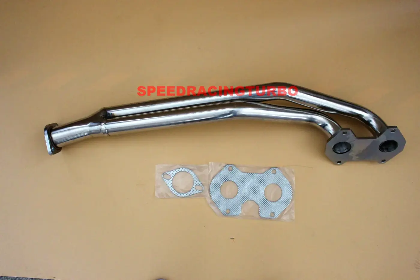 Side view of stainless steel exhaust header with 2.00 inch inlet and 2.50 inch outlet