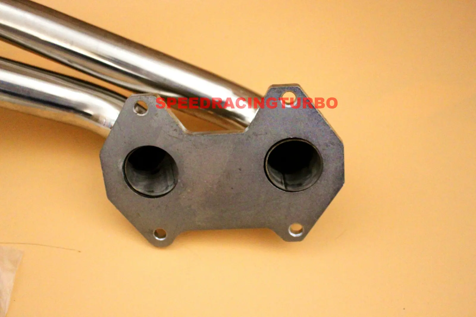 Detail of O2 sensor bung insertion with included metal gasket on RX-7 header