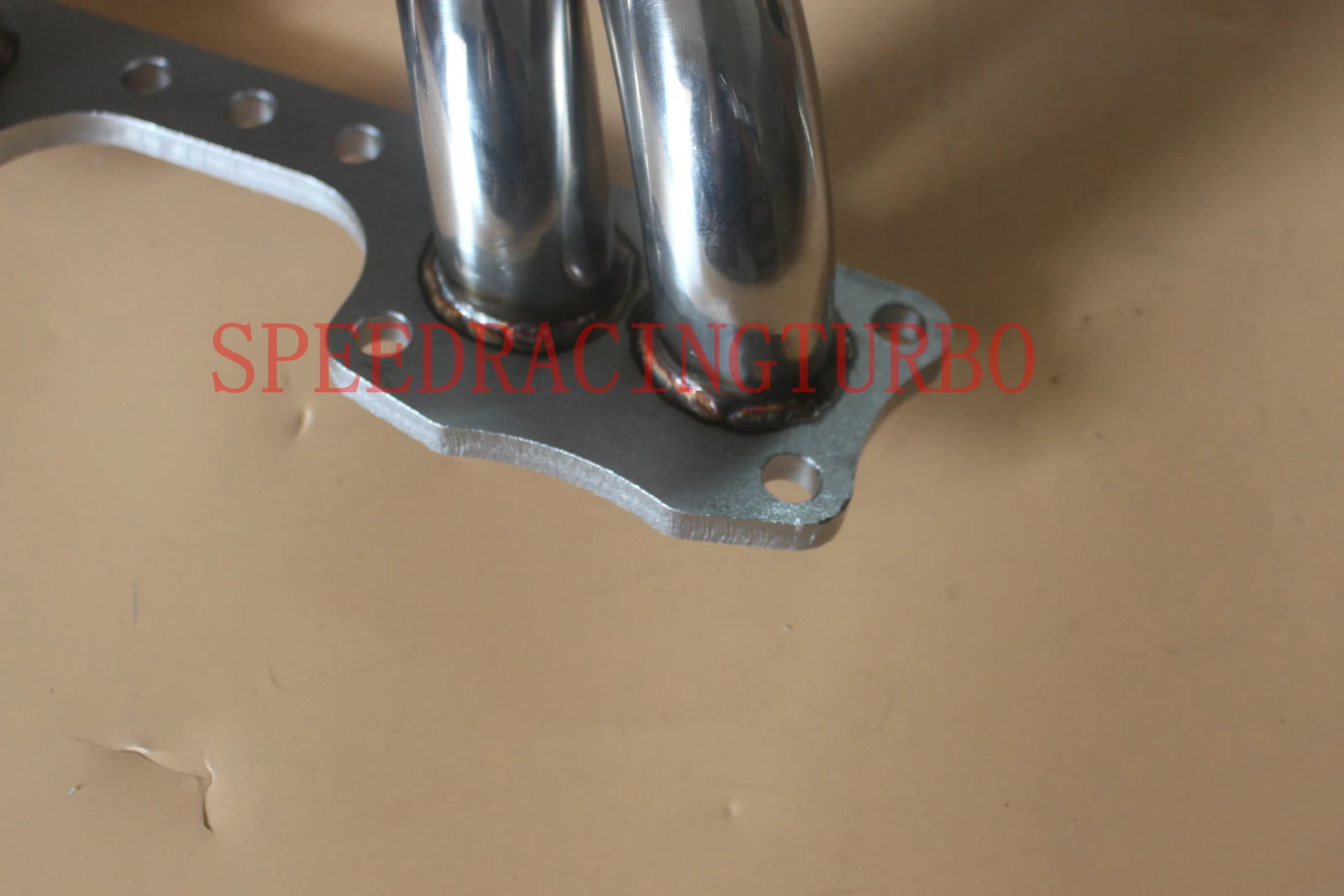 Back view of the header showing flange and collector junction