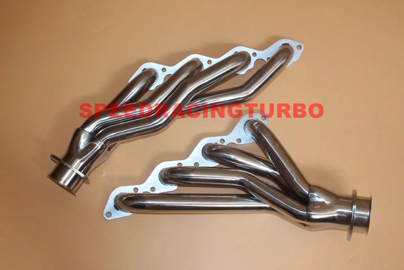 Close-up of CNC machined flange and polished header tube on a 1965-1973 BBC V8 header
