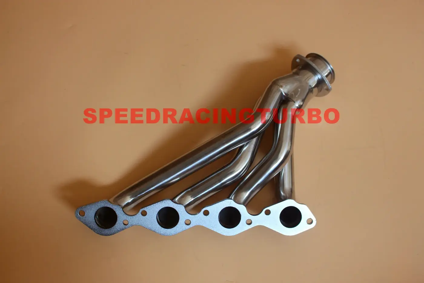 Pair of shorty headers installed on a classic Chevy truck engine with polished finish