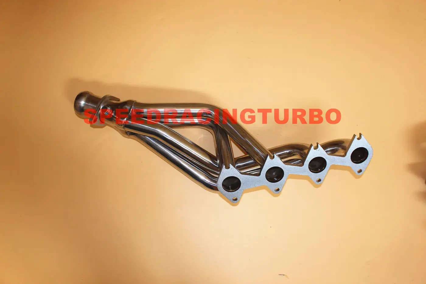 Pair of exhaust headers installed on a 2007 Ford Mustang engine bay