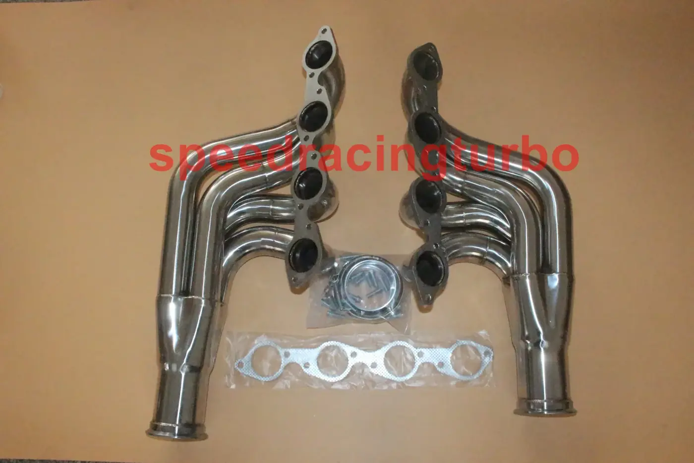 Close-up of CNC machined flange and TIG welded joint on a Chevy Big Block exhaust header