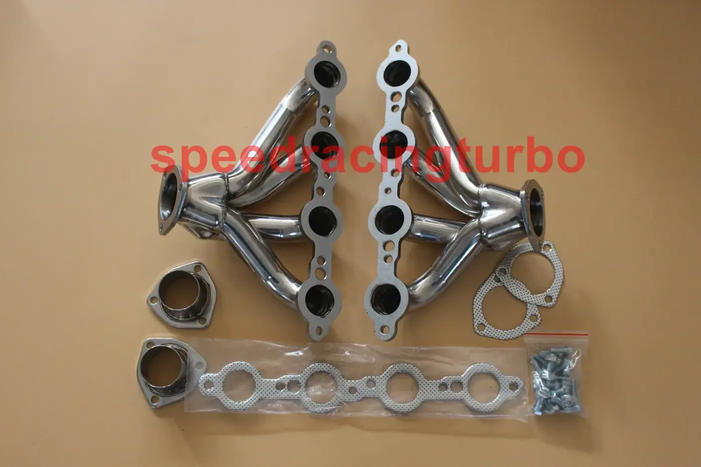 Side view of a pair of block hugger headers showing mandrel bent primaries and 2-1/2 inch collector