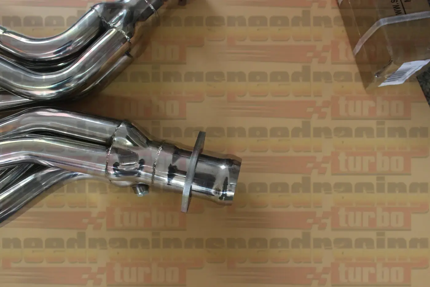 Header with pre-drilled O2 sensor ports and polished finish