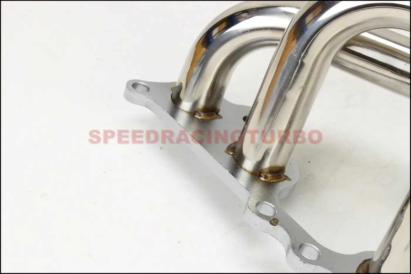 Back view of header showing exhaust outlet and mirror polished surface