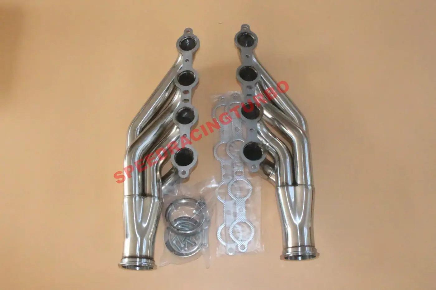 Close-up of polished stainless steel header flanges and gasket mounting points