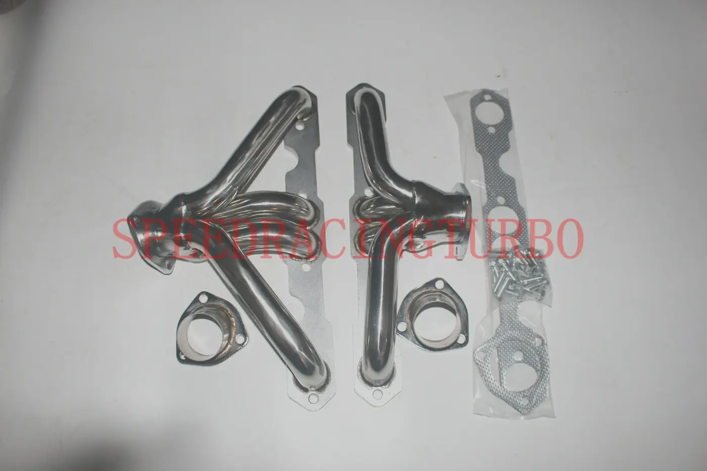 Close-up of polished T-304 stainless header with TIG welded joints and 4-1 racing design